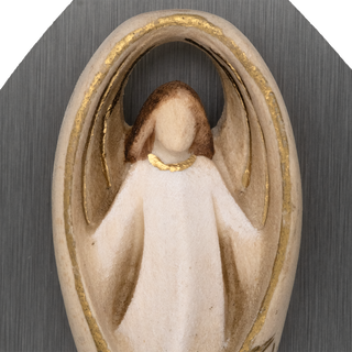 close-up pf a angel holy water font
