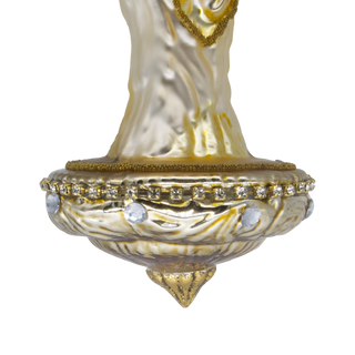 Detail of a vintage-style glass Christmas ornament depicting the Angel with Mary and Baby Jesus, with a gold-toned base and a hanging loop at the top.
