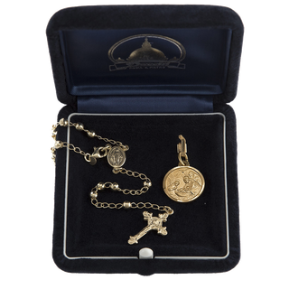 Baptism gift set in golden silver including a rosary and a christening medal