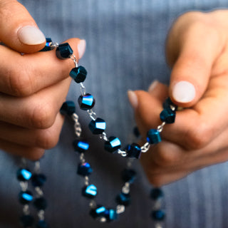 Metal rosary with intense blue crystal beads