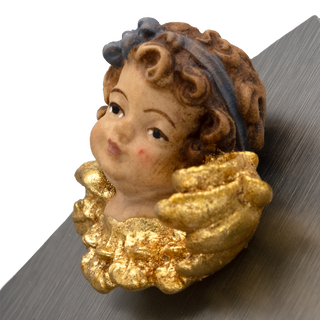 close-up pf a cherub angel holy water font