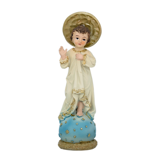 Child Jesus blessing statue in ivory and gold robe, standing on a blue starred globe