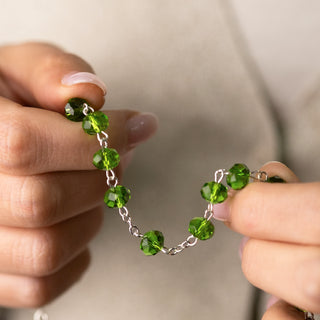 Metal rosary with green semi-crystal beads
