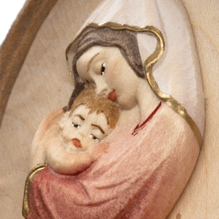 Detail of Madonna with Child holy water font for home in carved wood