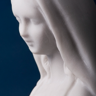 Close-up of a marble Miraculous Madonna statue