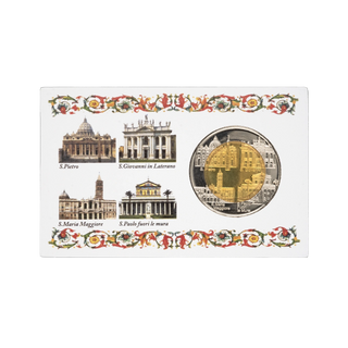 A souvenir coin insert card featuring four Vatican cityscape buildings with labels and a round gold coin depicting St. Peter's Basilica, set against a white background.