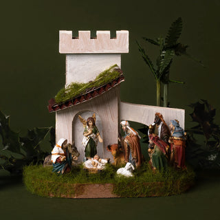 Nativity scene with magi and a tower against a dark background