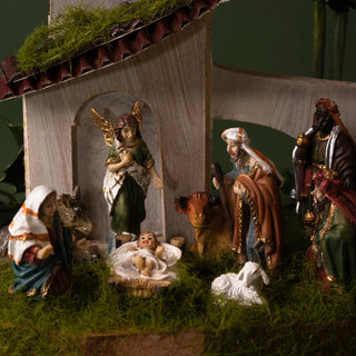 Nativity scene with figures of Mary, Joseph, baby Jesus, and the three wise men.