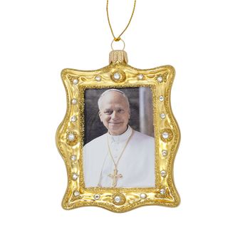 Gold-framed ornament with a picture of  Pope Leo XIV 