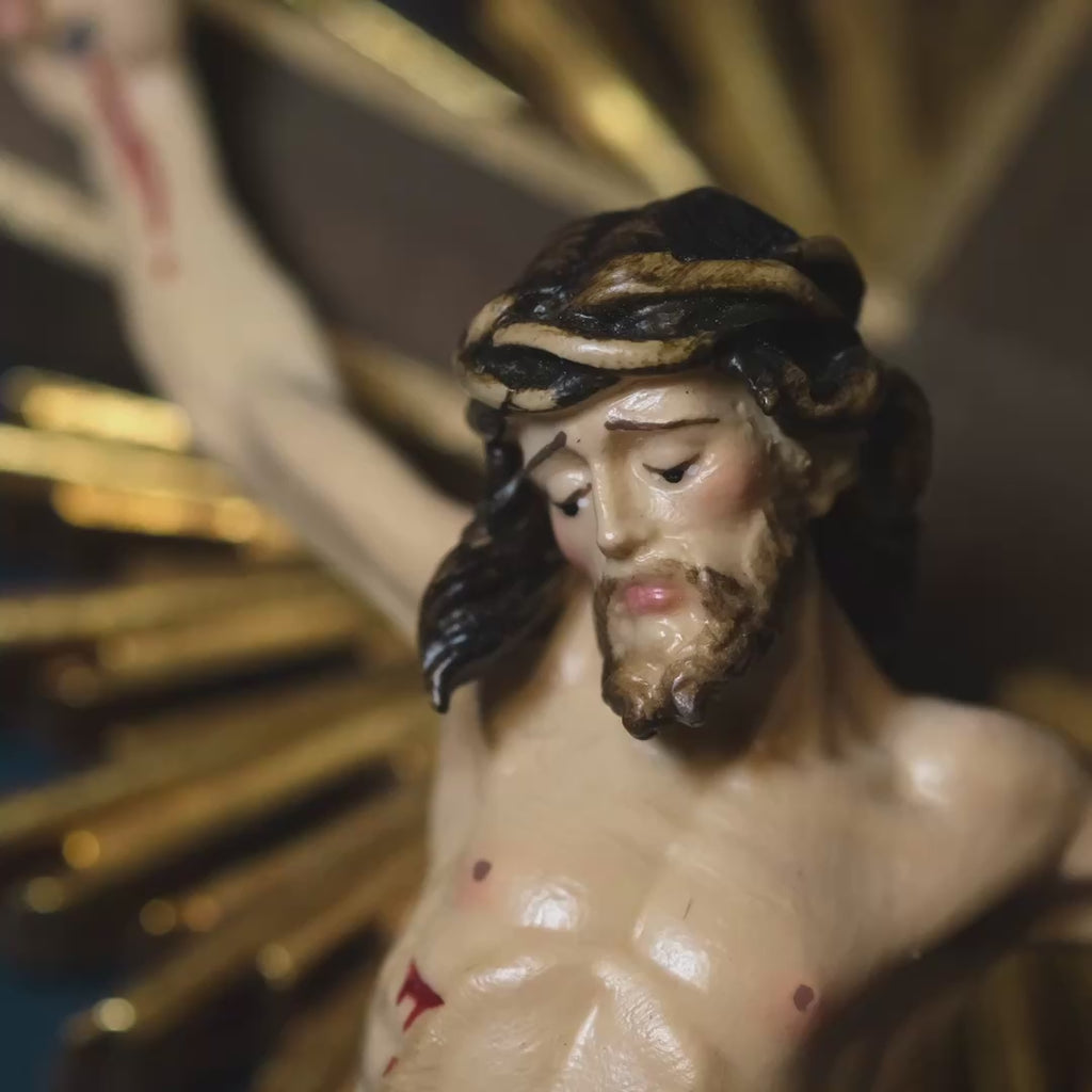 Decorative hand-carved wall crucifix with gold accents 