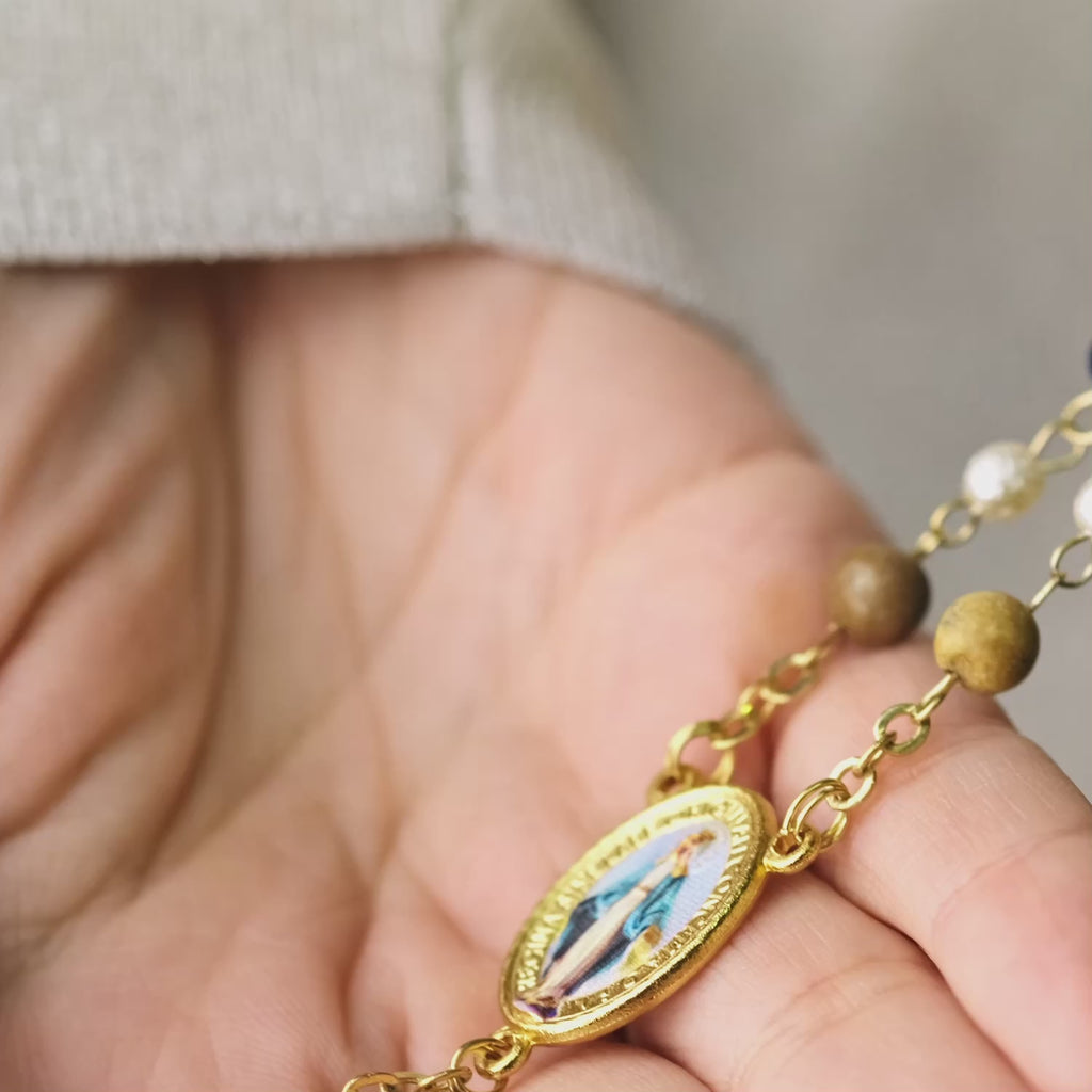 Rosary with multicolored beads and gold accents 