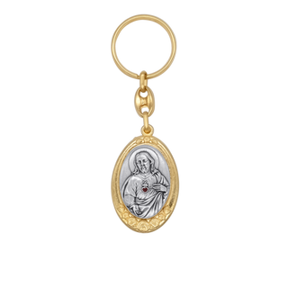 Gold and silver keychain with religious pendant of the Sacred Heart of Jesus