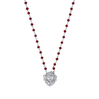 Necklace with red beads and a silver sacred heart-shaped pendant 