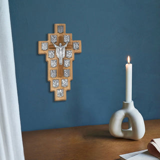 Station of the Cross Wall cross in Olive Wood on a blue wall in a room.