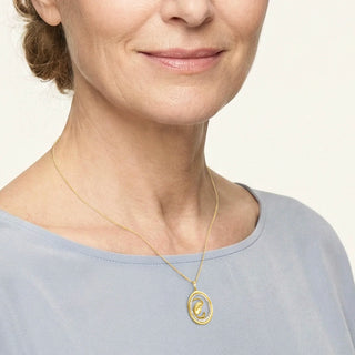 Woman wearing a Gold Diamond Virgin Mary Necklace on a white background