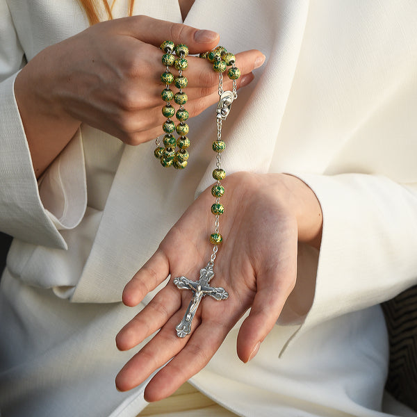 Metal rosary with green glass beads