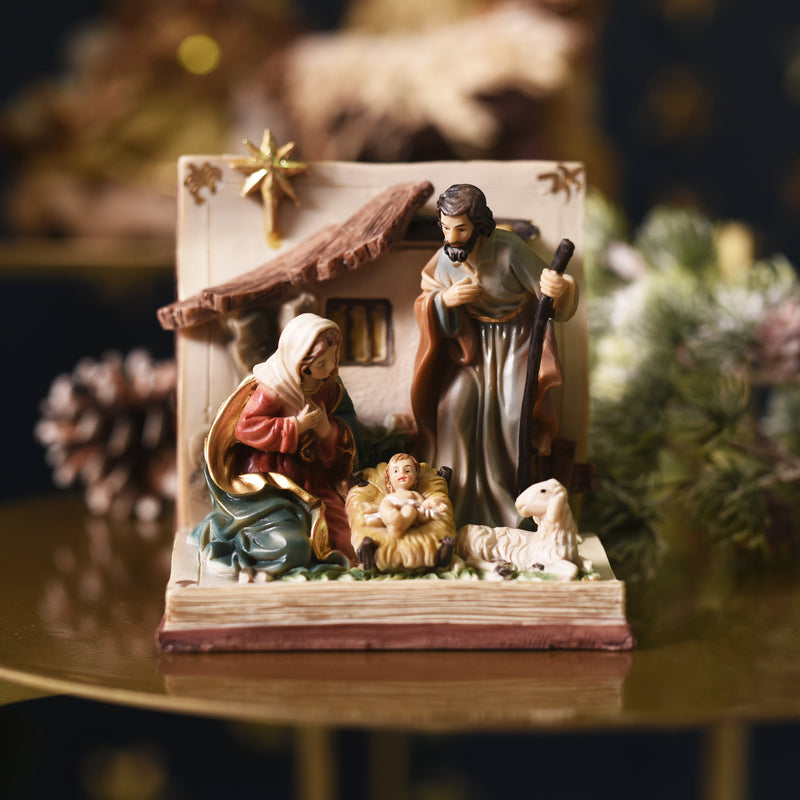 Holy Family on a book resin Nativity scene