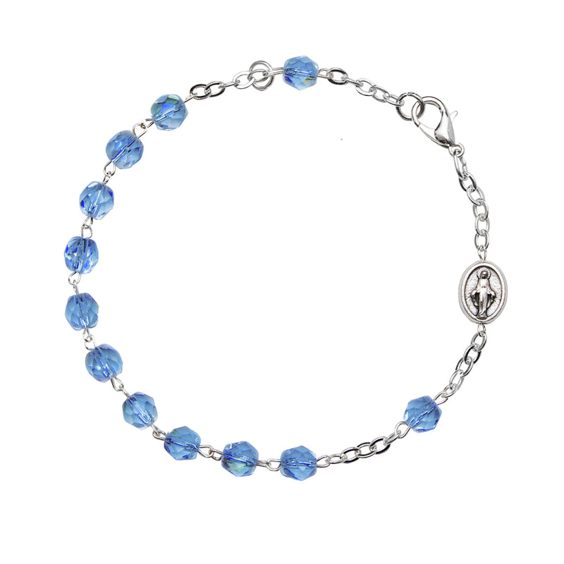 Rosary bracelet with light blue semi-crystal beads